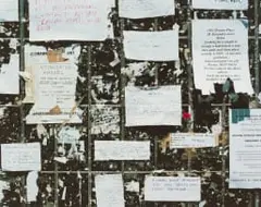 David Goldblatt, Adverts on the Wall at the Base of the Telkom Microwave Tower, Hillbrow, 15 January 2002, photographic print