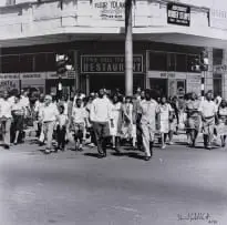 Saturday Morning at the Corner of Commissioner and Trichardt Streets, Boksburg by David Goldblatt, photographic print on paper, sold Mar 2023