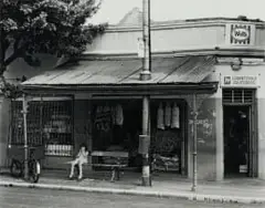 David Goldblatt, Slegs Blankes/Europeans Only, Bus Stop, Derby Road, Lorentzville, Johannesburg, December 1973, silver gelatin photograph on fiber-based paper