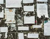 David Goldblatt, Adverts on the Wall at the Base of the Telkom Microwave Tower, Hillbrow, 15 January 2002