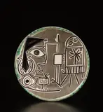 Jacqueline at the Easel (Jacqueline au chevalet) by Pablo Picasso, 1956, White earthenware round plate, painted in colors with brushed glaze; ceramic, Madoura edition, sold Apr 2019