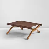 T. H. Robsjohn-Gibbings, "Diphros Okladias" folding stool, model no. 9, designed circa 1937, Walnut, leather, brass