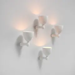 Jacques Grange, Set of four wall lights, circa 2021, Painted plaster