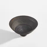 Lucie Rie, Bowl, circa 1973, Porcelain, manganese glaze with concentric bands of sgraffito design repeated inside and out