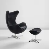 Arne Jacobsen, "Egg" chair, model no. 3316 and ottoman, model no. 3127, designed 1958, produced 1965, Aluminum, rubber, leather upholstery