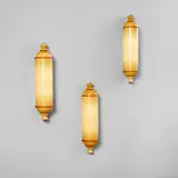 Napoleone Martinuzzi, Set of three wall lights, circa 1931, Incamiciato glass, nickel-plated brass