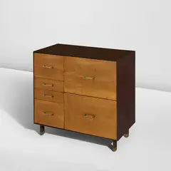 Rare cabinet by Finn Juhl, circa 1946, Maple, Cuban mahogany, brass, offered Jun 2026