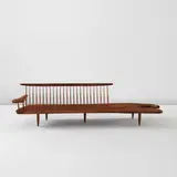 Rare and early "Conoid" bench with single free-form arm by George Nakashima, 1961, American black walnut, hickory, three East Indian rosewood butterfly keys, sold Jun 2026