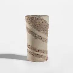 Vase by Lucie Rie, circa 1974, Mixed clays with manganese speckle producing integral grey volcanic and cream spiral beneath the glaze, sold Feb 2025