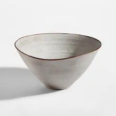 Salad bowl with pouring lip by Lucie Rie and Hans Coper, circa 1955, Stoneware with manganese speckle, white glaze with manganese rim, offered Feb 2025