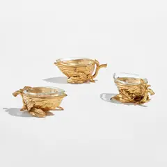 Three bowls, from the "Gocce Oro" series by Gabriella Crespi, circa 1985, Gilt bronze, glass, sold Feb 2025