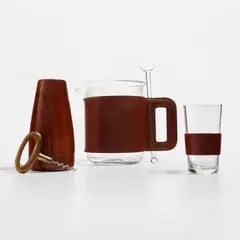 Carl Auböck, Cocktail set, model nos. 3710, 4643, and 3749/S, circa 1953, Glass, leather, walnut, brass