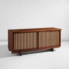 Two door cabinet by Mira Nakashima, 2007, American black walnut, pandanus cloth, sold Jun 2025