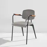 Jean Prouvé, "Conference" chair, model no. 355, circa 1953, Painted steel, oak, vinyl upholstery, rubber