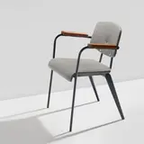 Jean Prouvé, "Conference" chair, model no. 355, circa 1953, Painted steel, oak, vinyl upholstery, rubber
