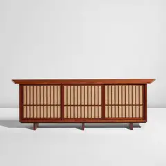 Free-edge cabinet with overhanging top by George Nakashima, 1956, American black walnut, pandanus cloth, sold Dec 2025