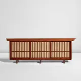Free-edge cabinet with overhanging top by George Nakashima, 1956, American black walnut, pandanus cloth, sold Dec 2025