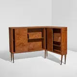 Corner bookcase by Gio Ponti, 1951, Laurel burl-veneered wood, brass, sold Dec 2025