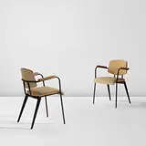 Jean Prouvé, Pair of "Conference" armchairs, model no. 355, circa 1954, Painted steel, oak, vinyl upholstery