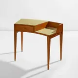 Desk by Gio Ponti, circa 1950, Ash, ash-veneered wood, plastic laminate-covered wood, brass, plastic, sold Jun 2024