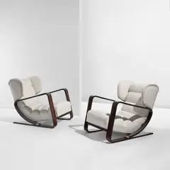 Piero Bottoni, Pair of wingback lounge chairs, circa 1936, Macassar ebony-veneered wood, fabric upholstery, steel