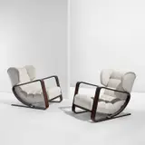 Piero Bottoni, Pair of wingback lounge chairs, circa 1936, Macassar ebony-veneered wood, fabric upholstery, steel