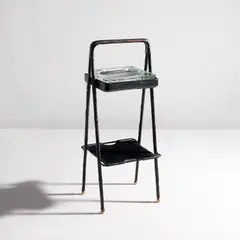 Ash stand by Jacques Adnet, circa 1955, Leather-covered steel, leather, glass, painted steel, brass, sold Feb 2024
