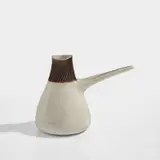 Creamer by Lucie Rie, circa 1965, Stoneware, manganese rim with sgraffito lines, sold Feb 2024