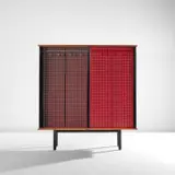 Two-sided wardrobe, designed for Cité Universitaire d'Antony, France by Jean Prouvé and Charlotte Perriand, circa 1954, Laminate-covered hardboard, painted steel, ash-veneered wood, aluminum, sold Dec 2024