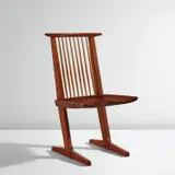"Conoid" chair by George Nakashima, 1985, American black walnut, hickory, sold Dec 2024