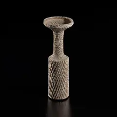 Lucie Rie, Vase with fluted body and flaring lip, circa 1960, Stoneware with manganese speckle, white pitted glaze over diagonally fluted body