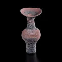 Vase with flaring lip by Lucie Rie, circa 1980, Mixed clays producing integral spiral beneath heavy pitted pink and blue glaze, sold Dec 2024