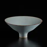 Lucie Rie, Footed bowl, circa 1966, Porcelain with cobalt and manganese speckle, light blue glaze with manganese rim