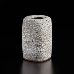 Squared vase by Lucie Rie, circa 1966, Stoneware with manganese speckle, pitted and flowing white glaze, sold Dec 2024