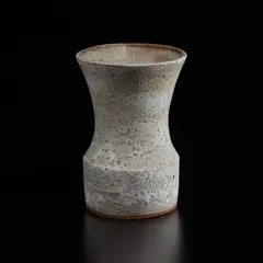 Vase with oval lip by Lucie Rie, circa 1968, Stoneware with manganese speckle, flowing and pitted white glaze, sold Dec 2024