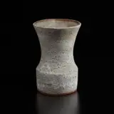 Vase with oval lip by Lucie Rie, circa 1968, Stoneware with manganese speckle, flowing and pitted white glaze, sold Dec 2024