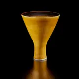 Conical footed vase by Lucie Rie, circa 1968, Porcelain, shiny mustard yellow glaze, interior with manganese and sgraffito bands, sold Dec 2024