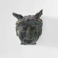"Aktaeon" mask by Axel Salto, circa 1932, Stoneware with Solfatara glaze, sold Jun 2024