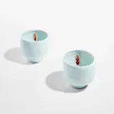 Two teabowls by Edmund de Waal, circa 2005, Porcelain, celadon glaze, red glazes over impressed designs in the interior, sold Feb 2023