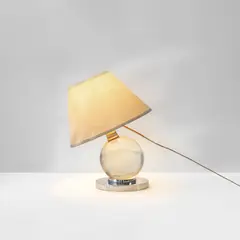 Adjustable table lamp, model no. 7706 by Jacques Adnet, circa 1930, Crystal, nickel-plated bronze, fabric shade, sold Jun 2023