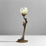 "Magnolia" table lamp by Daum Frères and Louis Majorelle, circa 1904, Opalescent blown and wheel-carved iridescent glass, patinated bronze, sold Jun 2023
