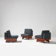 George Nakashima, Set of three lounge chairs, from the "Origins" collection, circa 1959, Walnut with "Sundra" finish, fabric upholstery