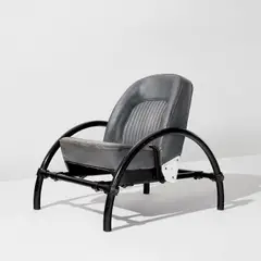 "Rover" chair by Ron Arad, designed 1981, Painted steel, aluminum, leather upholstery, sold Jul 2023
