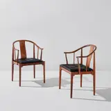 Hans J. Wegner, Two "China" armchairs, model no. 4283, designed 1944, executed 1969-1970, Brazilian rosewood, vinyl upholstery
