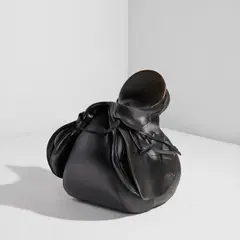 Ika Kuenzel, "Caution This Is Rodeo ALL BLACK" chair, 2006, Stitched leather saddle with patinated steel stirrups, vinyl upholstery