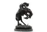 Untitled by Frederic Remington, on a green marble base, sold May 2024