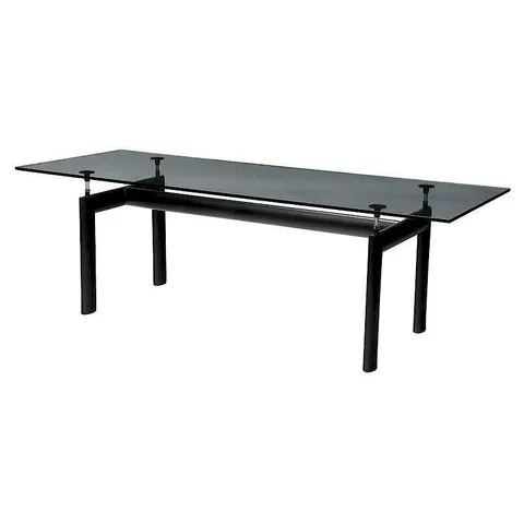 Designed LC-6 Table by Le Corbusier, 1928, features a clear glass top over a steel base, offered Jul 2017