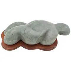 Olmeca contemporáneo jugando consigo mismo by Eduardo Olbés, 2013, Escultura tallada en jadeita verde celadón en base de madera, offered Mar 2024