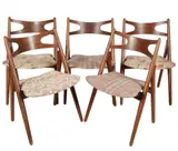 FIve Sawbuck Side Chairs Model CH29 by Hans J. Wegner, the seats covered with later fabric, sold Apr 2025