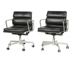Charles and Ray Eames, Two Soft Pad Management Chairs, black leather